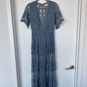 Resort season romper with low v-neck